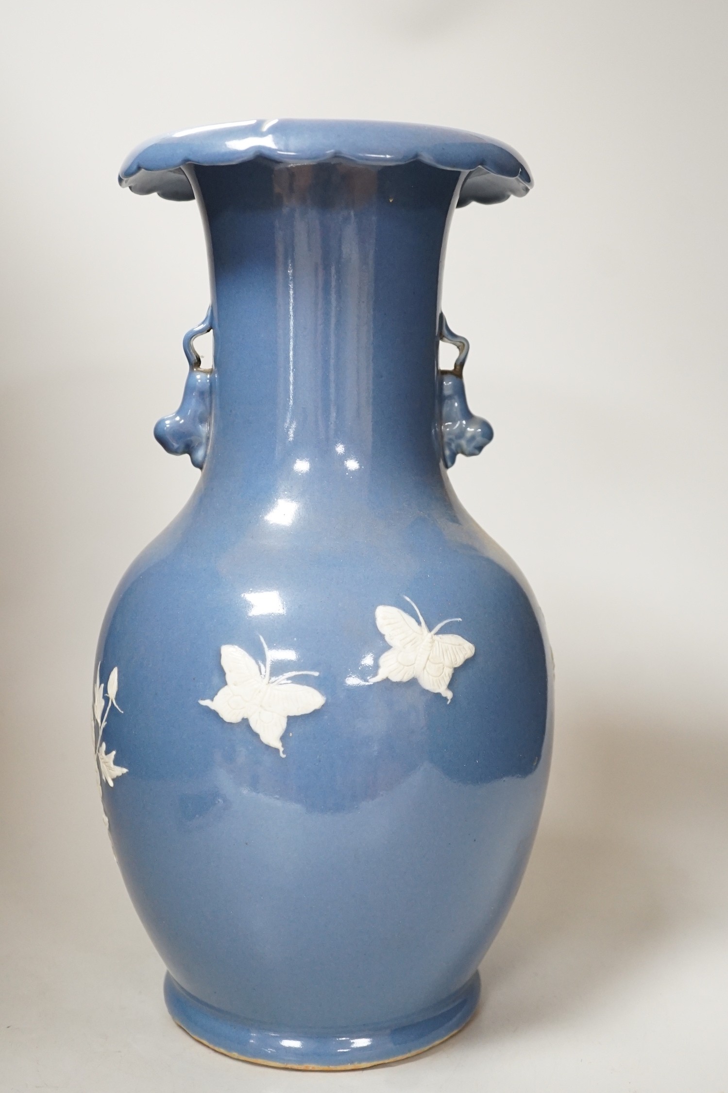 A Chinese slip-decorated blue glazed vase, 40cm